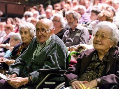 Older people and people with Alzheimer's enjoying a cultural activity