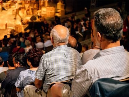 Homeless people enjoying a cultural activity
